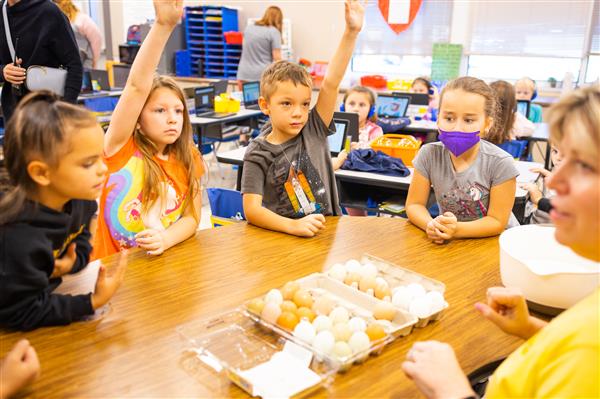Students learning about Green Eggs and Ham and how to make them. 